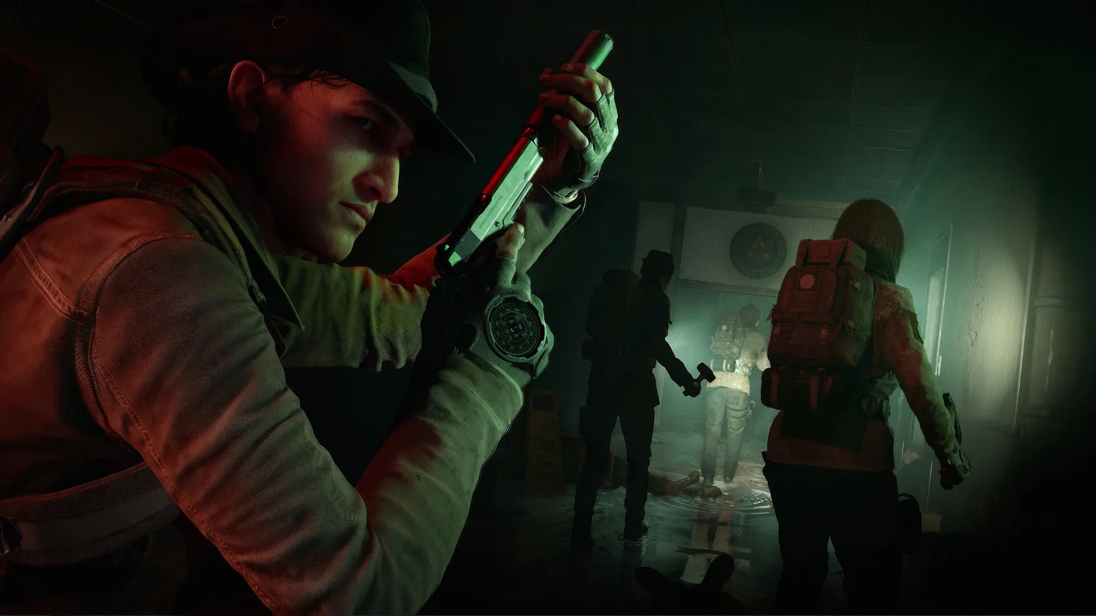 Responders moving cautiously through a dark infected interior